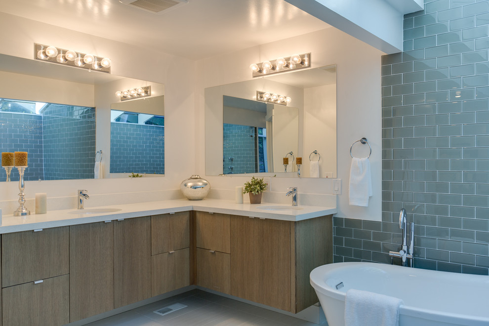 Bathroom - large modern master gray tile and glass tile porcelain tile bathroom idea in Salt Lake City with an undermount sink, flat-panel cabinets, medium tone wood cabinets, quartz countertops, a one-piece toilet and white walls