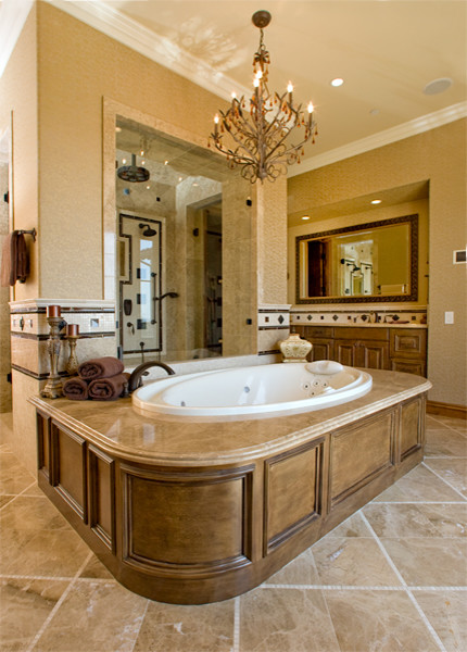 Idées déco pour une grande salle de bain principale méditerranéenne en bois brun avec un placard avec porte à panneau encastré, une baignoire posée, une douche double, WC à poser, un carrelage multicolore, un carrelage de pierre, un mur beige, un sol en marbre, un lavabo encastré et un plan de toilette en marbre.