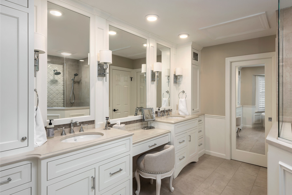 Inspiration for a medium sized classic ensuite bathroom in St Louis with flat-panel cabinets, white cabinets, a freestanding bath, a corner shower, beige tiles, porcelain tiles, beige walls, porcelain flooring, a submerged sink, engineered stone worktops, beige floors, a hinged door and beige worktops.