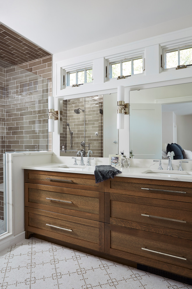 Inspiration for a mid-sized transitional master double-sink bathroom remodel in Minneapolis with recessed-panel cabinets, medium tone wood cabinets, an undermount sink, a hinged shower door and a built-in vanity