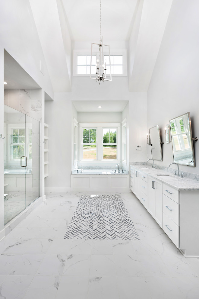 Huge transitional master white tile and porcelain tile porcelain tile and white floor doorless shower photo in Louisville with shaker cabinets, white cabinets, an undermount tub, a two-piece toilet, white walls, an undermount sink, marble countertops and a hinged shower door