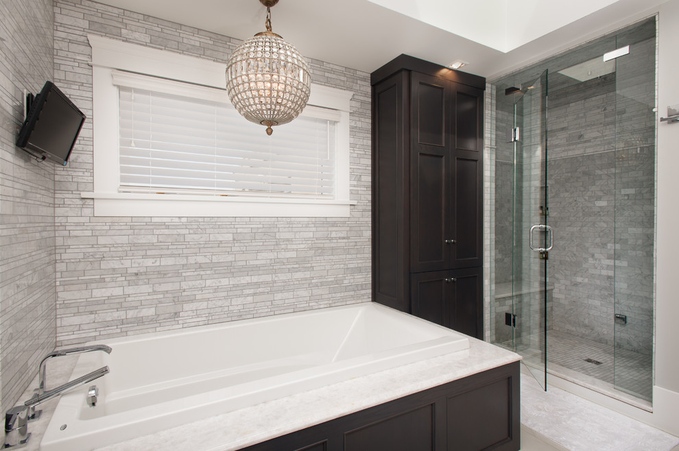 This is an example of a large traditional ensuite bathroom in Vancouver with recessed-panel cabinets, dark wood cabinets, a built-in bath, an alcove shower, white walls, a submerged sink, porcelain flooring and engineered stone worktops.