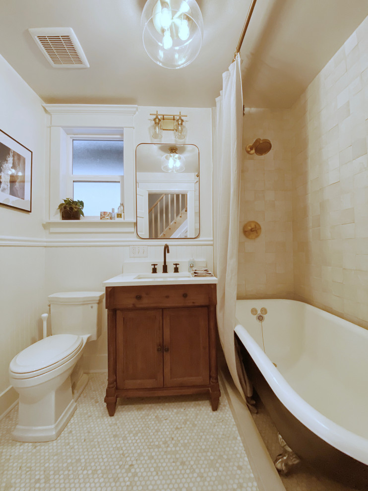 Inspiration for a small classic ensuite bathroom in Seattle with recessed-panel cabinets, brown cabinets, a claw-foot bath, a shower/bath combination, a two-piece toilet, white tiles, terracotta tiles, white walls, mosaic tile flooring, a submerged sink, engineered stone worktops, white floors, a shower curtain, white worktops, a single sink, a freestanding vanity unit and wainscoting.