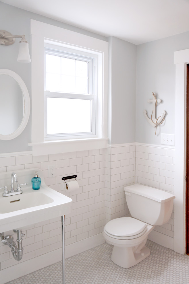 Bathroom - coastal mosaic tile floor bathroom idea in Boston with a console sink
