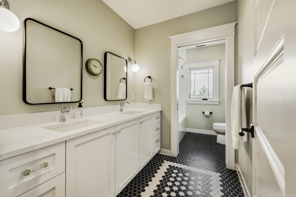 Large transitional kids' ceramic tile marble floor, black floor and double-sink bathroom photo in Seattle with shaker cabinets, white cabinets, beige walls, an undermount sink, marble countertops, white countertops and a built-in vanity