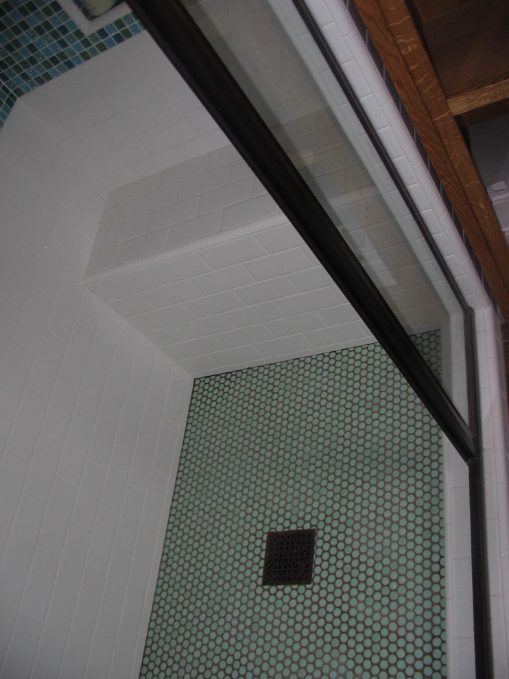 Alcove shower - mid-sized craftsman 3/4 blue tile and mosaic tile ceramic tile and brown floor alcove shower idea in San Diego with flat-panel cabinets, medium tone wood cabinets, a two-piece toilet, white walls, an integrated sink, glass countertops and a hinged shower door