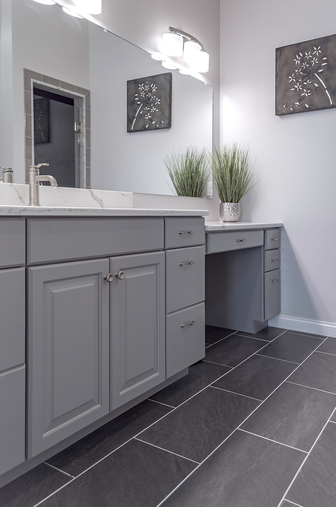 Inspiration for a small traditional ensuite bathroom in Providence with raised-panel cabinets, grey cabinets, a two-piece toilet, grey tiles, ceramic tiles, grey walls, ceramic flooring, a submerged sink and engineered stone worktops.