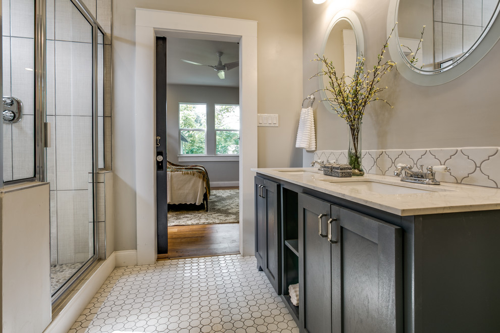 Design ideas for a medium sized classic ensuite bathroom in Austin with recessed-panel cabinets, blue cabinets, an alcove shower, a two-piece toilet, white tiles, ceramic tiles, grey walls, ceramic flooring, a submerged sink, quartz worktops, white floors, a hinged door and white worktops.