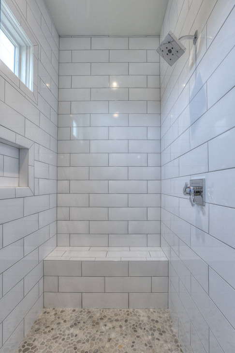 This is an example of a medium sized traditional shower room bathroom in Nashville with flat-panel cabinets, white cabinets, an alcove shower, white tiles, metro tiles, white walls, porcelain flooring, a submerged sink and quartz worktops.