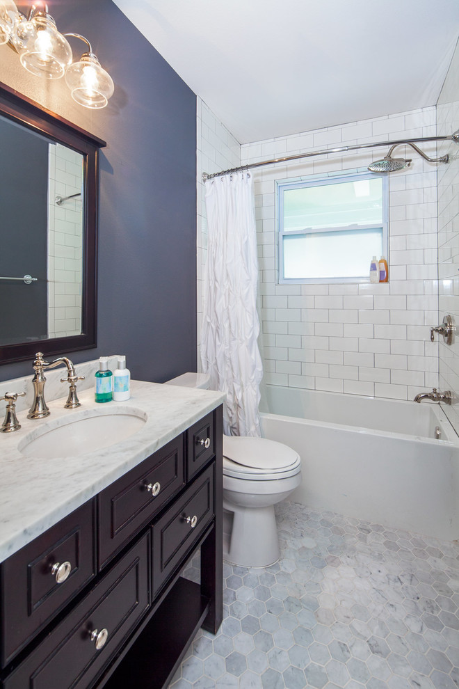 Bathroom - small transitional white tile bathroom idea in Austin with granite countertops