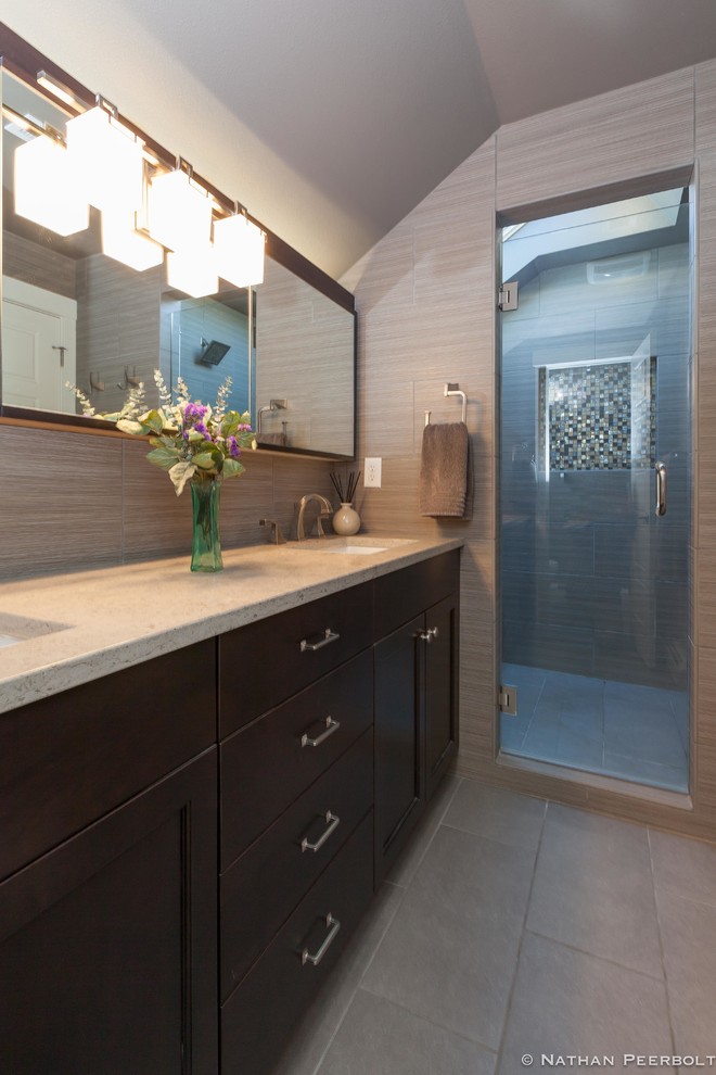 Walk-in shower - mid-sized craftsman master ceramic tile ceramic tile walk-in shower idea in Denver with shaker cabinets, quartzite countertops and a hinged shower door