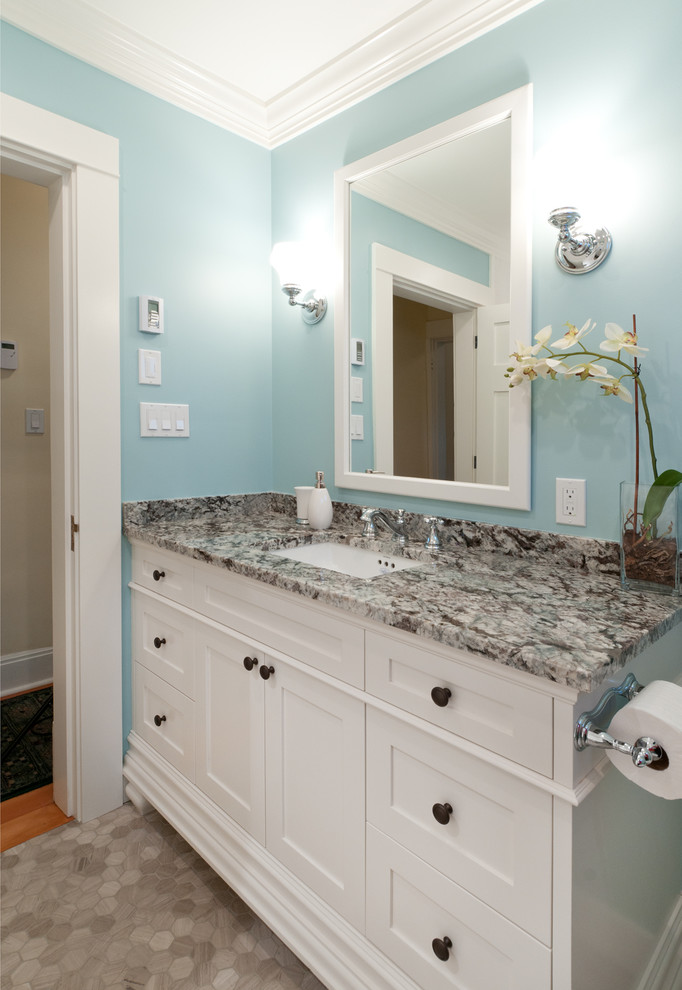 Bathroom - small craftsman 3/4 multicolored tile and stone slab ceramic tile bathroom idea in Vancouver with an undermount sink, shaker cabinets, white cabinets, granite countertops, a two-piece toilet and blue walls
