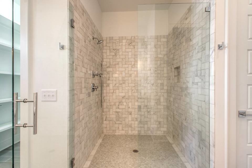 Alcove shower - large transitional master white tile and porcelain tile porcelain tile alcove shower idea in Nashville with shaker cabinets, white cabinets, white walls, an undermount sink and quartzite countertops