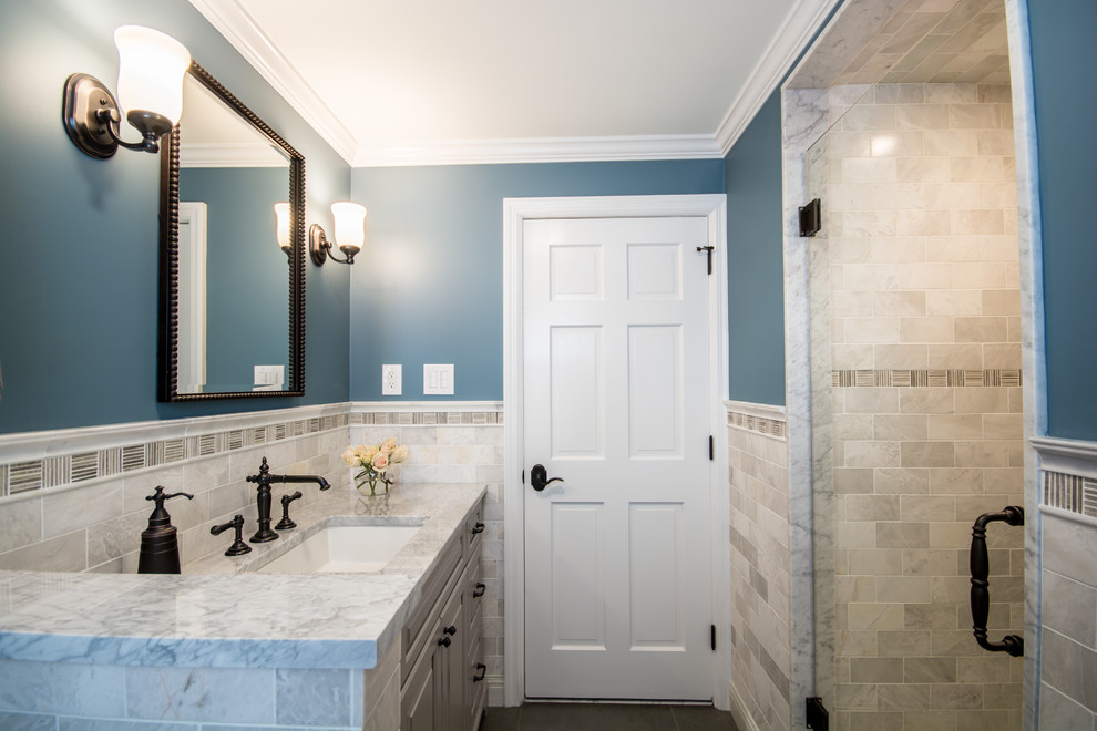 Inspiration for a mid-sized timeless 3/4 white tile and subway tile porcelain tile alcove shower remodel in Providence with raised-panel cabinets, gray cabinets, a two-piece toilet, blue walls, an undermount sink and marble countertops