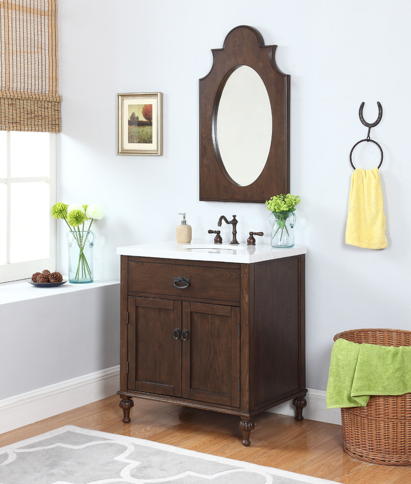 Idée de décoration pour une salle de bain tradition en bois brun avec un plan de toilette en marbre.