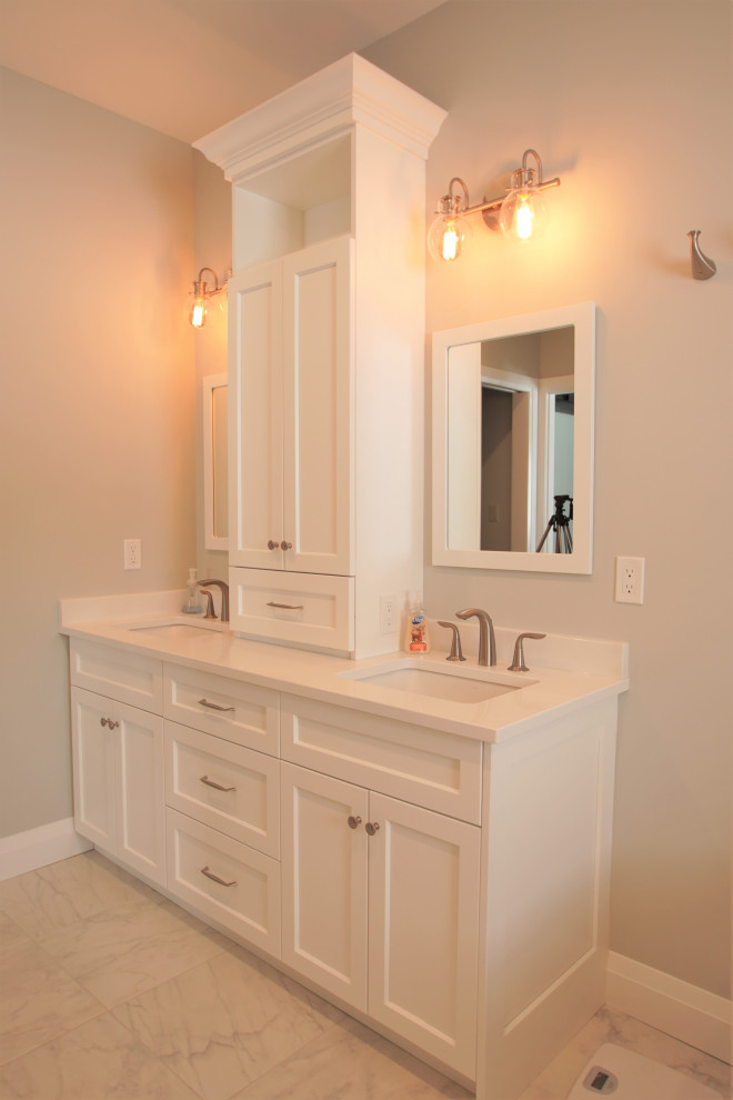 Large traditional ensuite bathroom in Toronto with shaker cabinets, white cabinets, a freestanding bath, an alcove shower, a two-piece toilet, grey tiles, metro tiles, grey walls, porcelain flooring, a submerged sink, engineered stone worktops, white floors, a sliding door and white worktops.