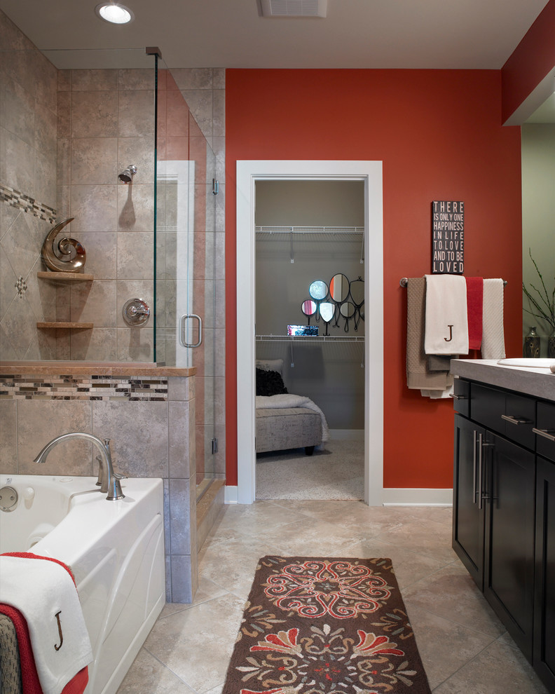 Medium sized classic ensuite bathroom in Other with a built-in sink, shaker cabinets, dark wood cabinets, laminate worktops, a built-in bath, a corner shower, grey tiles, ceramic tiles, red walls, ceramic flooring and a one-piece toilet.