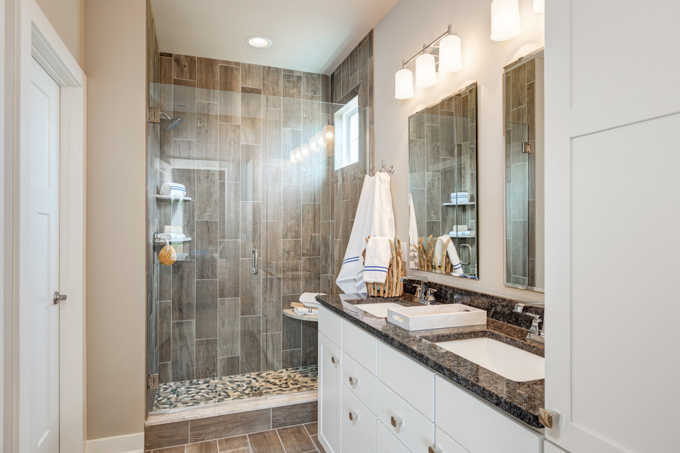 Alcove shower - large coastal master brown tile and ceramic tile ceramic tile alcove shower idea in Other with flat-panel cabinets, white cabinets, gray walls, a drop-in sink and granite countertops