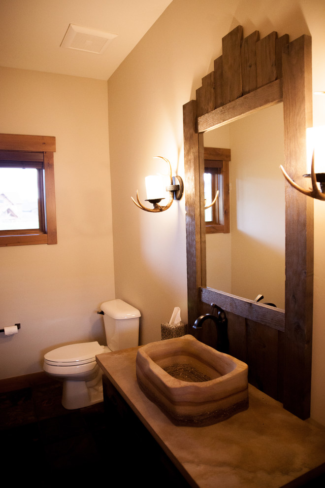 Mid-sized southwest 3/4 concrete floor and multicolored floor bathroom photo in Denver with a two-piece toilet, beige walls, a vessel sink and concrete countertops