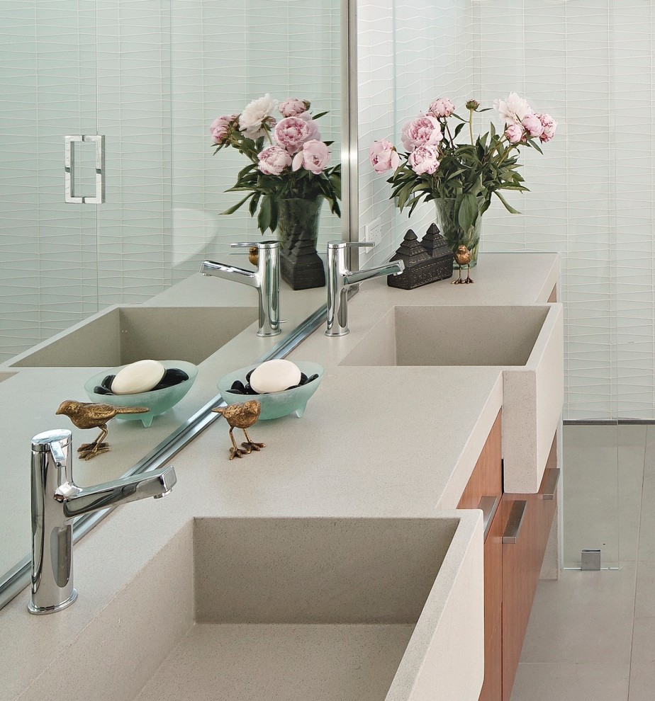 Inspiration for a medium sized midcentury ensuite bathroom in San Francisco with flat-panel cabinets, brown cabinets, a freestanding bath, a built-in shower, white tiles, grey walls, cement flooring, an integrated sink, engineered stone worktops, grey floors, a hinged door and beige worktops.