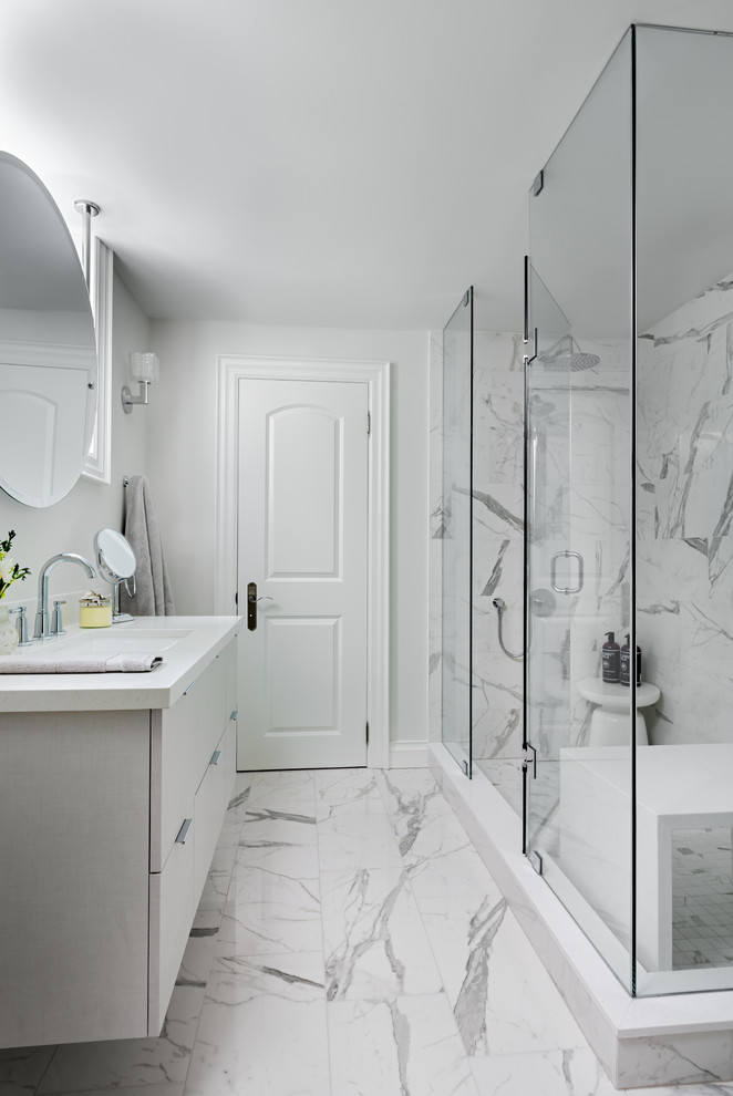 Mid-sized transitional kids' white tile and cement tile ceramic tile and white floor corner shower photo in Toronto with flat-panel cabinets, gray cabinets, a one-piece toilet, gray walls, an undermount sink, quartz countertops and a hinged shower door