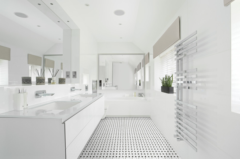 Alcove bathtub - mid-sized contemporary master porcelain tile alcove bathtub idea in Philadelphia with an undermount sink, flat-panel cabinets, white cabinets, white walls, a wall-mount toilet, glass countertops and white countertops