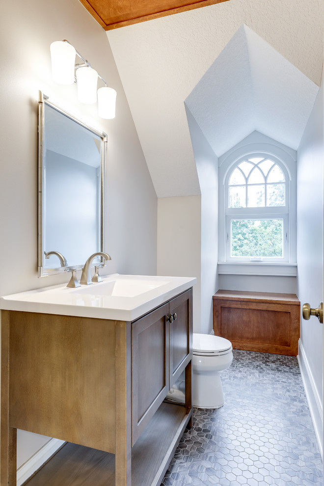 Design ideas for a traditional bathroom in Minneapolis with shaker cabinets, medium wood cabinets, white walls, mosaic tile flooring, a console sink and grey floors.