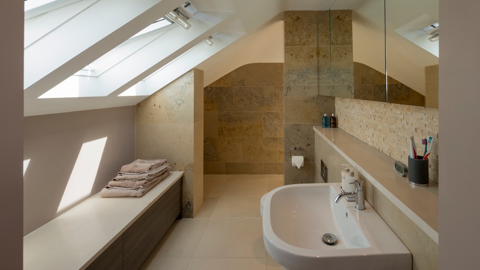 Photo of a large contemporary ensuite bathroom in Other with flat-panel cabinets, medium wood cabinets, a walk-in shower, a wall mounted toilet, beige tiles, stone tiles, beige walls, travertine flooring, a wall-mounted sink and wooden worktops.