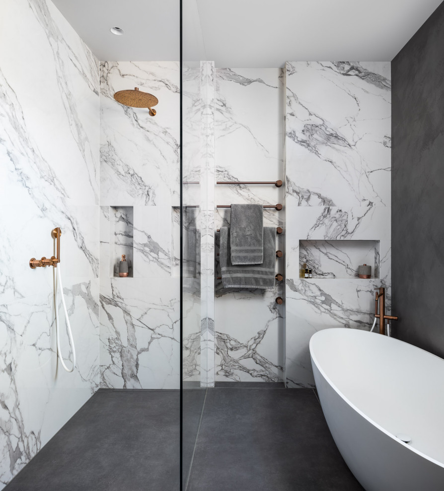 Mid-sized trendy kids' gray tile double-sink walk-in shower photo in London with recessed-panel cabinets, dark wood cabinets, gray walls, a drop-in sink, marble countertops, white countertops and a floating vanity