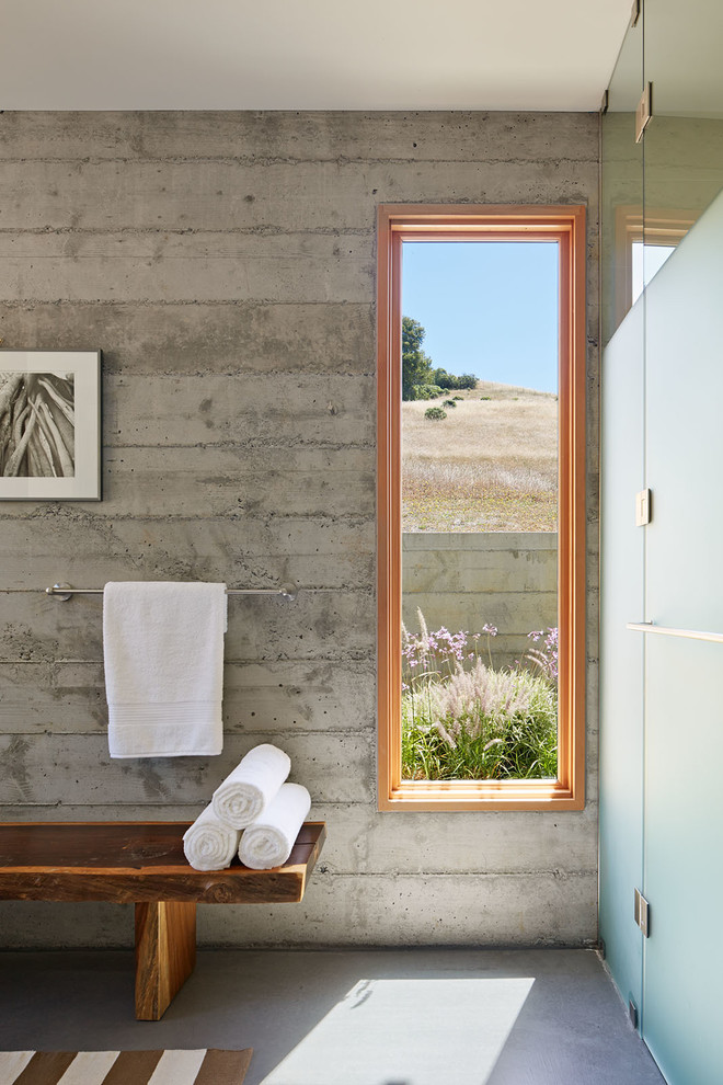 Large minimalist master white tile and porcelain tile concrete floor walk-in shower photo in San Francisco with flat-panel cabinets, blue cabinets, an undermount tub, a two-piece toilet, gray walls, an undermount sink and quartz countertops