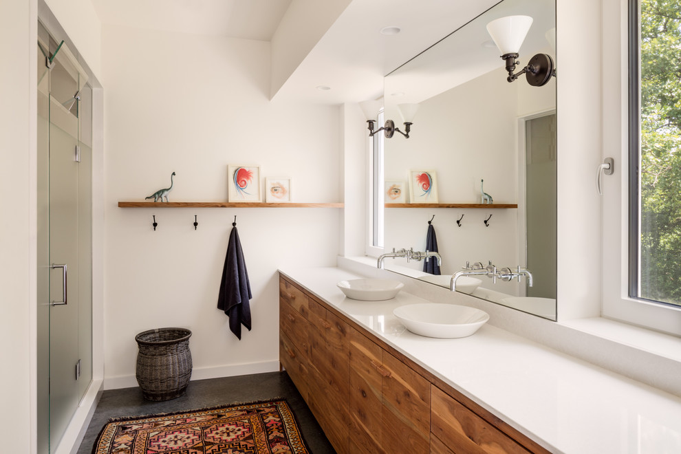 Bathroom - mid-sized country master yellow tile concrete floor and gray floor bathroom idea in Other with medium tone wood cabinets, white walls, a vessel sink, quartz countertops, a hinged shower door and flat-panel cabinets
