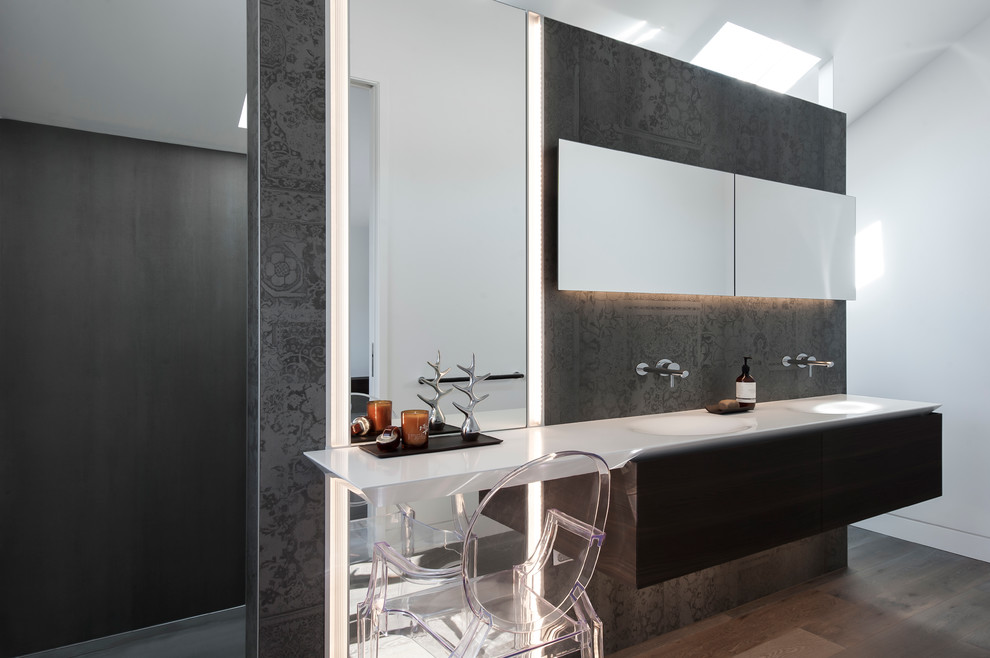 Design ideas for a small modern ensuite bathroom in Sydney with an integrated sink, freestanding cabinets, medium wood cabinets, solid surface worktops, a walk-in shower, a one-piece toilet, grey tiles, porcelain tiles, grey walls and porcelain flooring.