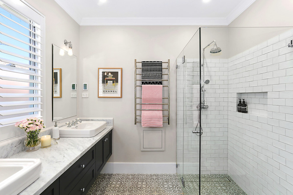 Mid-sized elegant 3/4 white tile and ceramic tile ceramic tile and beige floor bathroom photo in Sydney with shaker cabinets, black cabinets, beige walls, a console sink and marble countertops