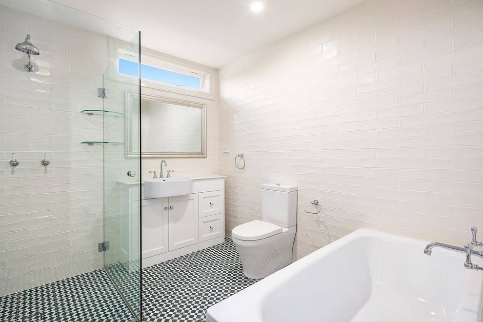 Bathroom - large transitional master white tile and porcelain tile ceramic tile bathroom idea in Sydney with shaker cabinets, white cabinets, a one-piece toilet, white walls, a trough sink and quartz countertops