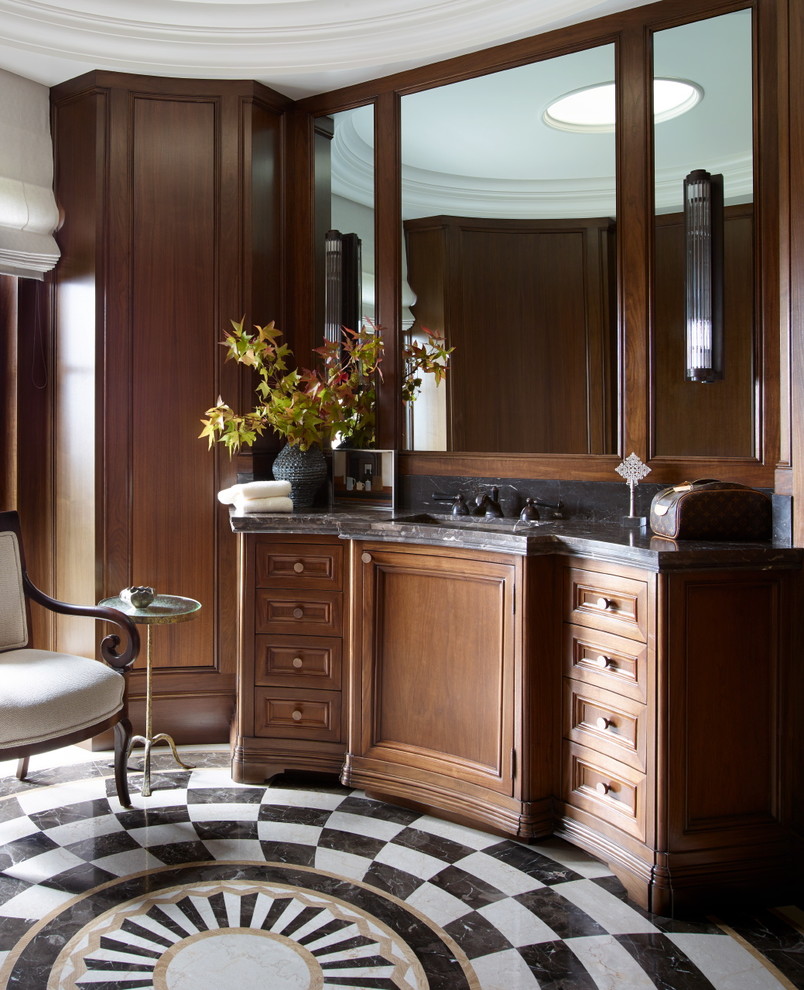 This is an example of a mediterranean ensuite bathroom in Orange County with recessed-panel cabinets, medium wood cabinets, brown walls, a submerged sink and multi-coloured floors.