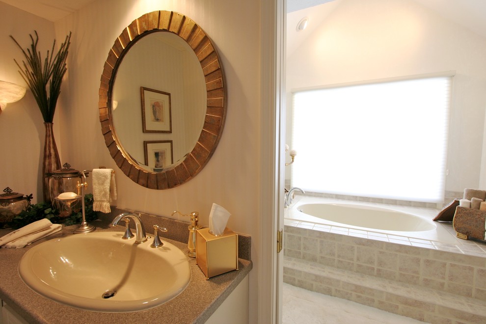 This is an example of a medium sized classic shower room bathroom in Chicago with white cabinets, a built-in bath, ceramic flooring and a built-in sink.