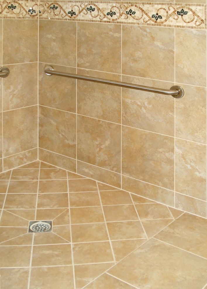 Inspiration for a mid-sized transitional master beige tile and porcelain tile porcelain tile walk-in shower remodel in Los Angeles with an integrated sink, raised-panel cabinets, light wood cabinets, granite countertops and yellow walls