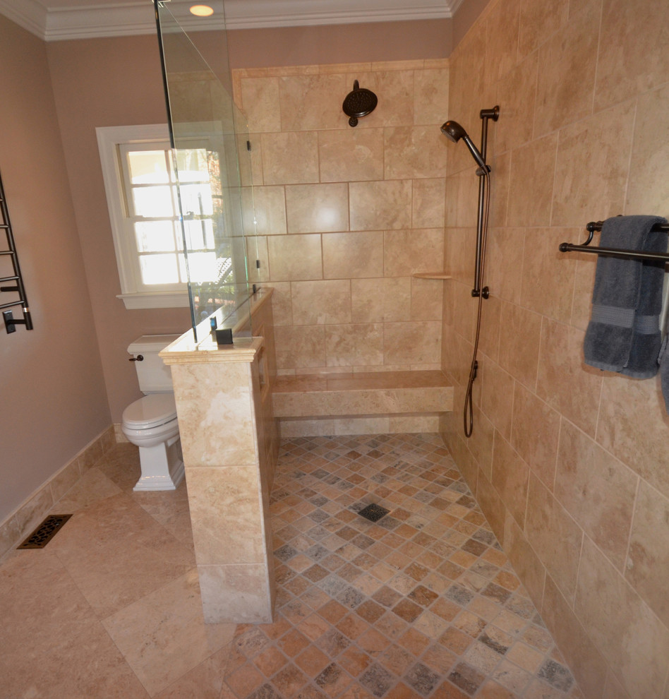 Mid-sized tuscan master beige tile beige floor walk-in shower photo in Raleigh with beige walls and a hinged shower door