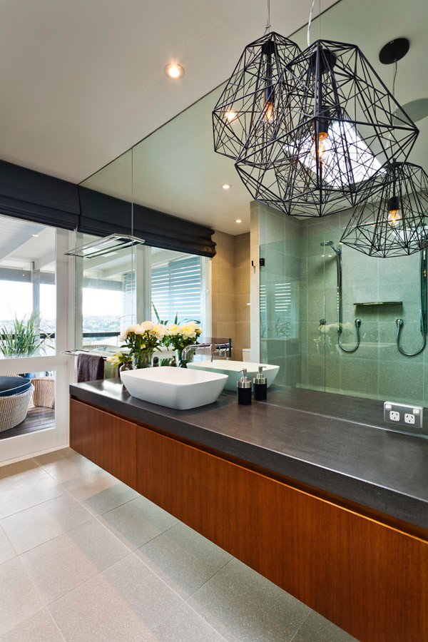 Photo of a large contemporary ensuite bathroom in Sydney with a console sink, recessed-panel cabinets, medium wood cabinets, solid surface worktops, beige tiles, ceramic tiles and ceramic flooring.