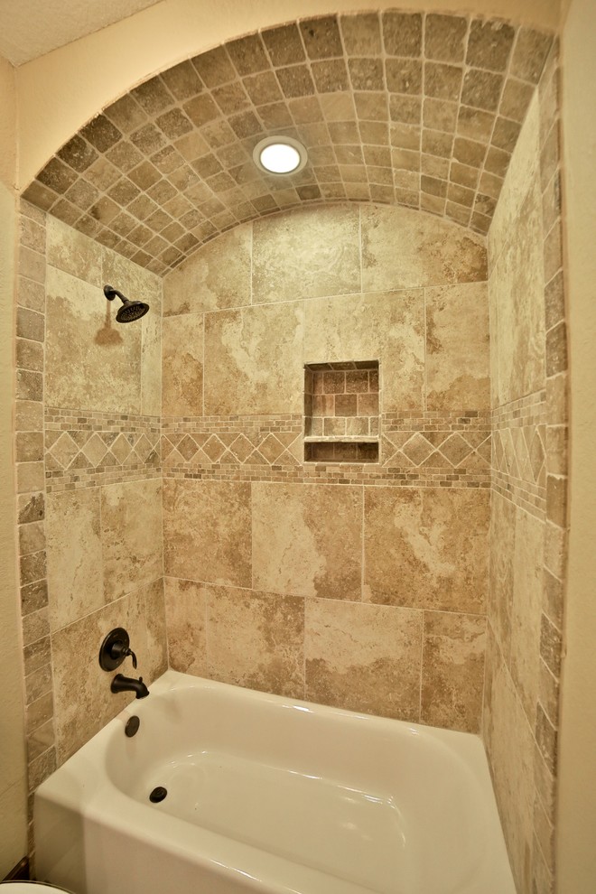 Bathroom - mid-sized rustic master beige tile and porcelain tile bathroom idea in Dallas with raised-panel cabinets, medium tone wood cabinets and granite countertops