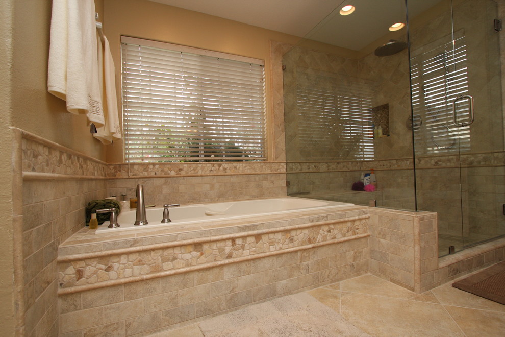 Inspiration for a large timeless master beige tile and porcelain tile medium tone wood floor bathroom remodel in Orange County with an undermount sink, raised-panel cabinets, medium tone wood cabinets, granite countertops, a one-piece toilet and beige walls