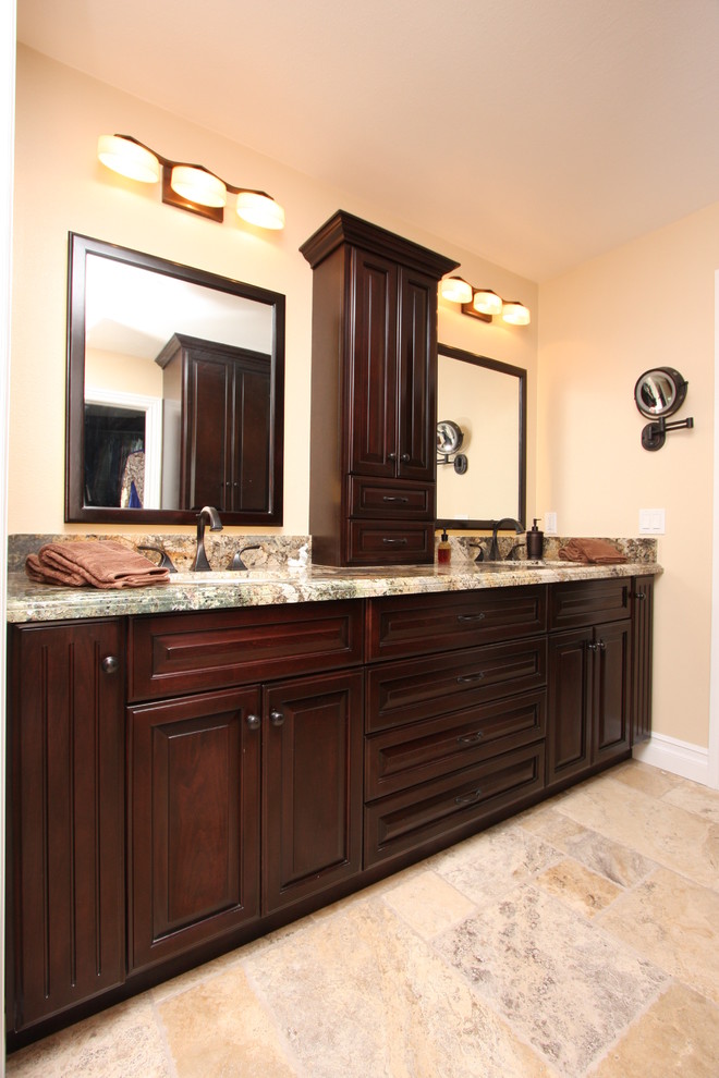 Inspiration for a mid-sized timeless master multicolored tile and porcelain tile porcelain tile bathroom remodel in Orange County with an undermount sink, raised-panel cabinets, dark wood cabinets, granite countertops, a two-piece toilet and beige walls
