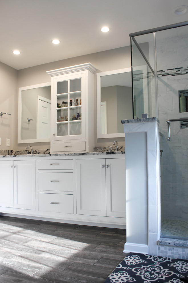 Inspiration for a mid-sized transitional master stone tile bathroom remodel in Philadelphia with shaker cabinets, white cabinets, white walls, an undermount sink and soapstone countertops