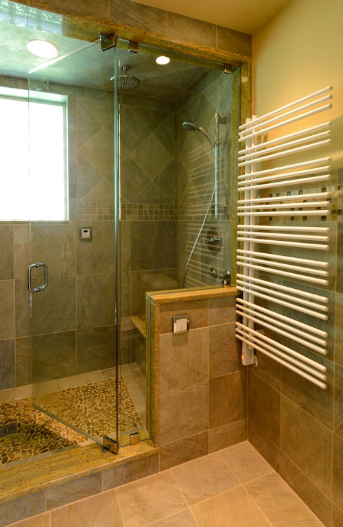 Alcove shower - mid-sized eclectic master beige tile, brown tile, multicolored tile, white tile and mosaic tile alcove shower idea in Boston with flat-panel cabinets, light wood cabinets, a two-piece toilet, beige walls and a drop-in sink