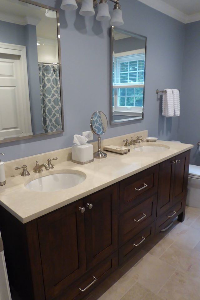 Design ideas for a medium sized classic family bathroom in DC Metro with a submerged sink, shaker cabinets, dark wood cabinets, solid surface worktops, beige tiles, porcelain tiles, blue walls and ceramic flooring.