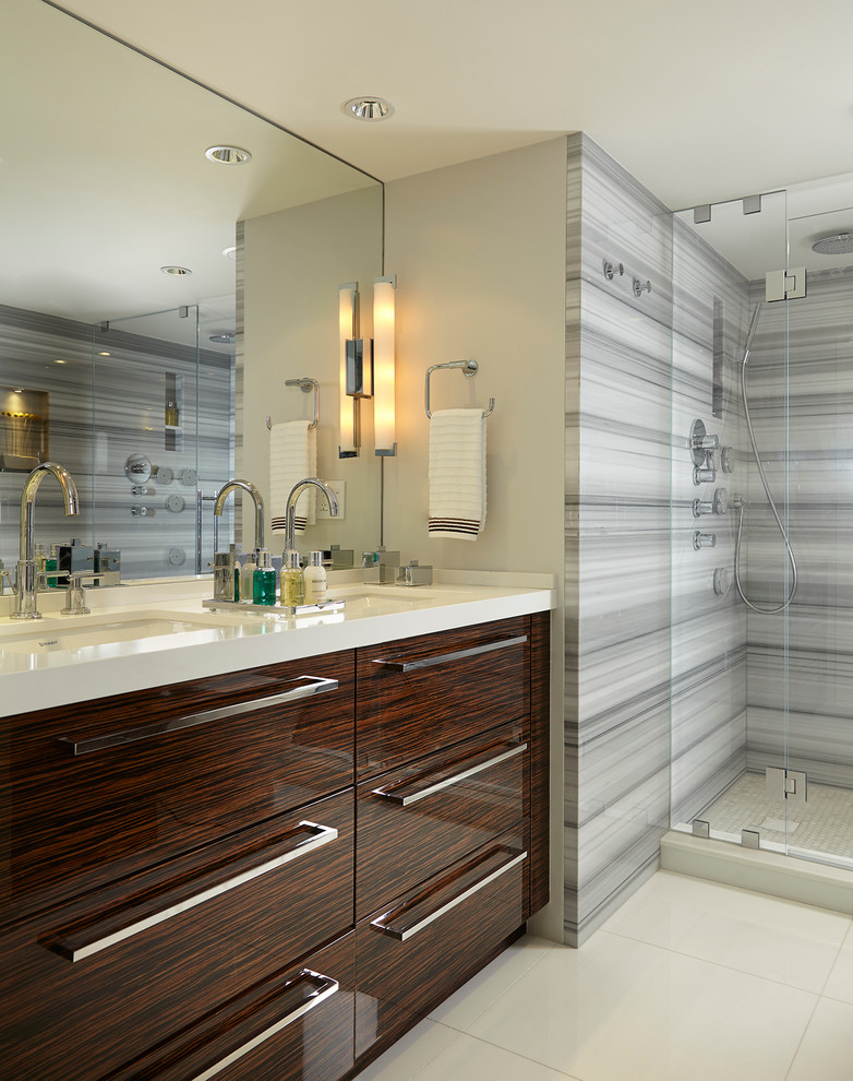 Inspiration for a mid-sized eclectic master white tile and stone tile porcelain tile alcove shower remodel in Miami with flat-panel cabinets, dark wood cabinets, a one-piece toilet, white walls, an undermount sink and quartzite countertops