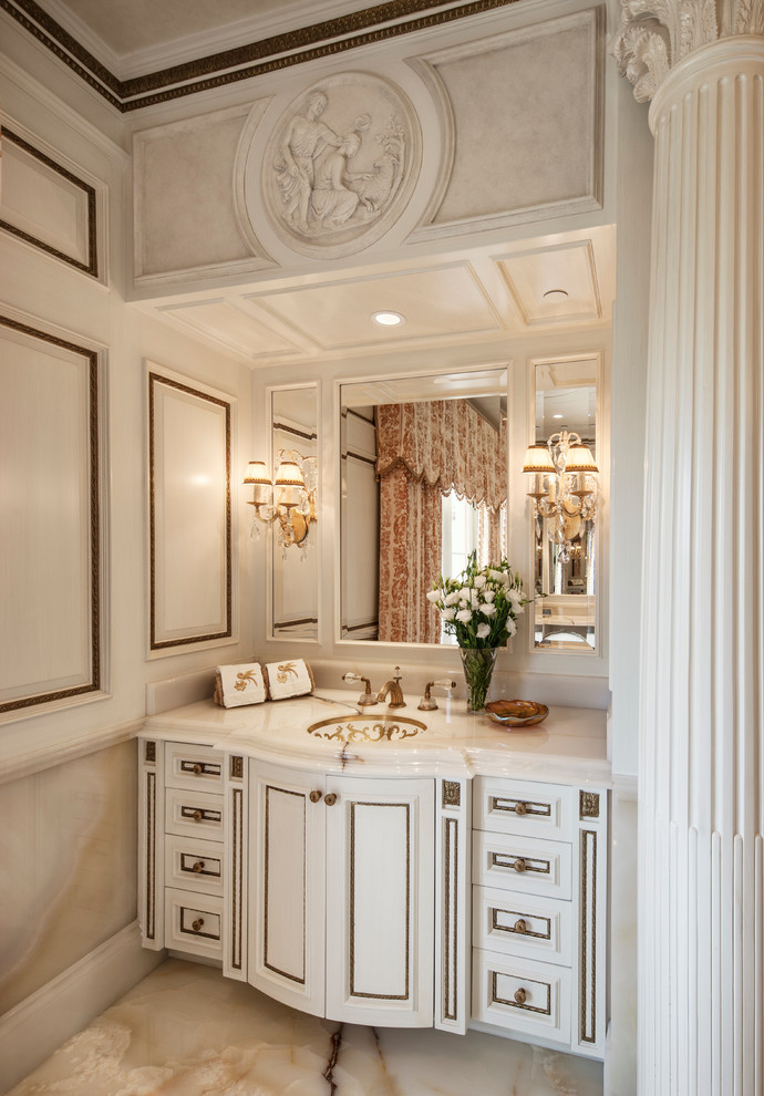 Photo of a traditional bathroom in Los Angeles with white cabinets, multi-coloured walls and recessed-panel cabinets.