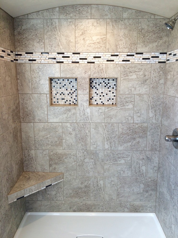 Example of a mid-sized arts and crafts master gray tile and ceramic tile doorless shower design in Other with solid surface countertops