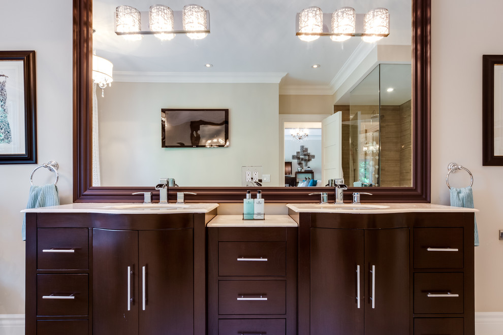 Photo of a large contemporary ensuite bathroom in Toronto with flat-panel cabinets, dark wood cabinets, a corner shower, beige walls, a submerged sink and quartz worktops.