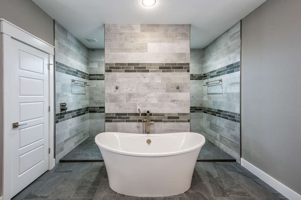 Large transitional master gray tile ceramic tile and gray floor bathroom photo in Other with flat-panel cabinets, gray cabinets, gray walls, a vessel sink and quartzite countertops